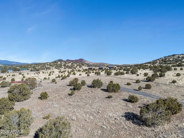a view of a beach with a mountain in the background