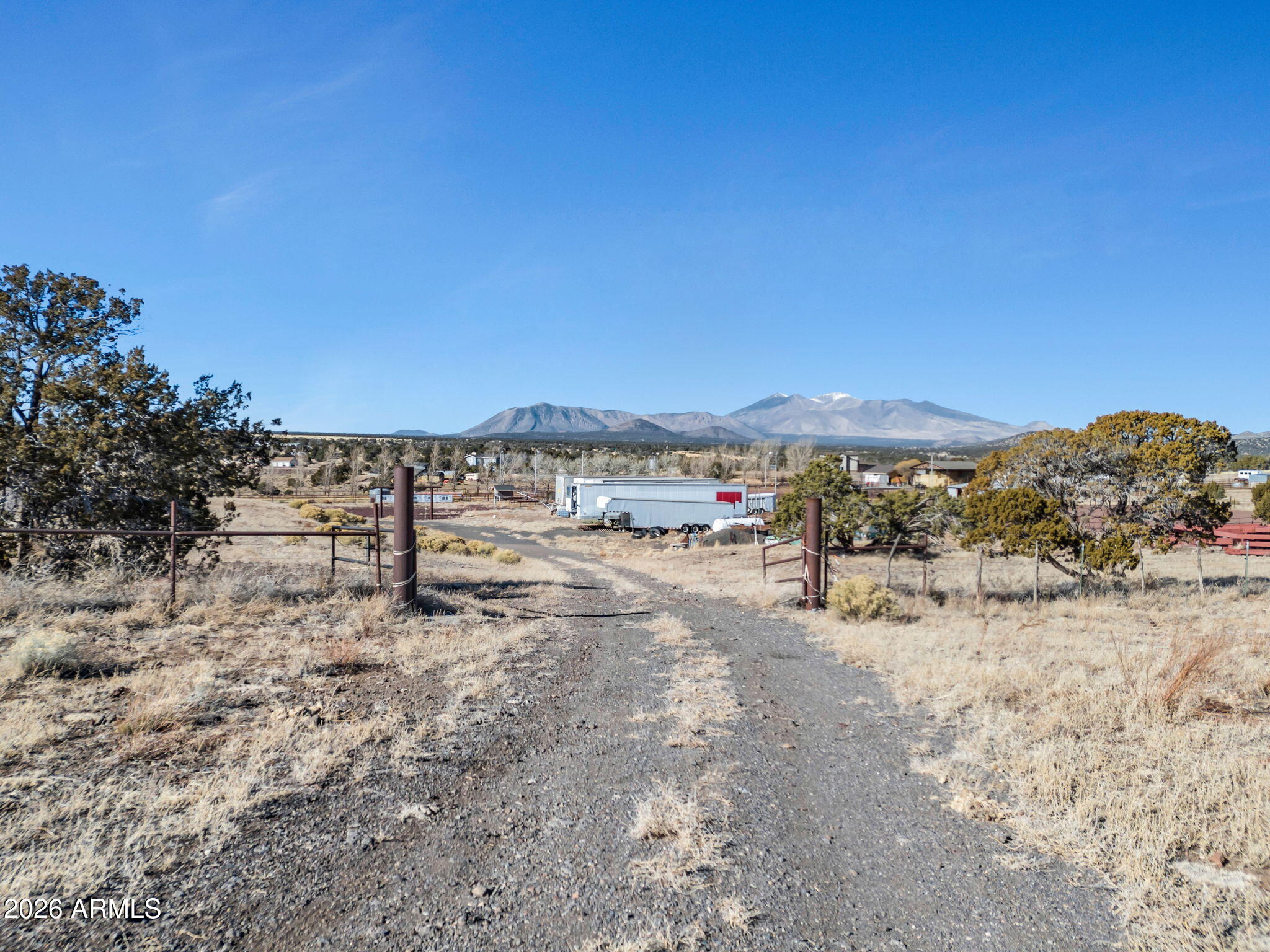 13170 Stockmens Road Flagstaff, AZ 86004 - Photo 5 of 30 a view of a field with trees in the background