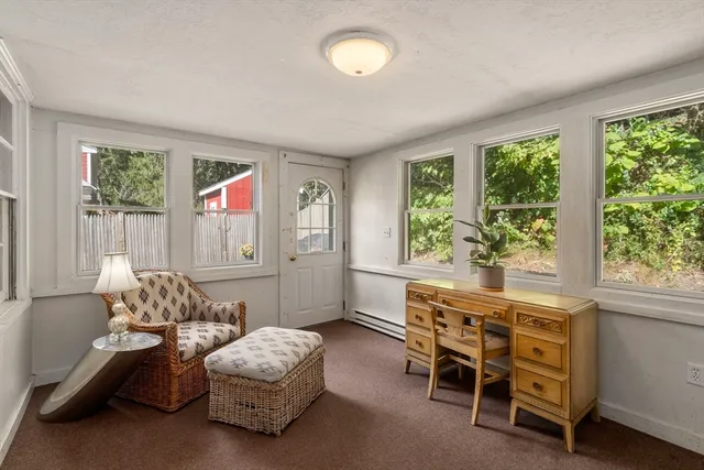 a bathroom with a sink a toilet and a window