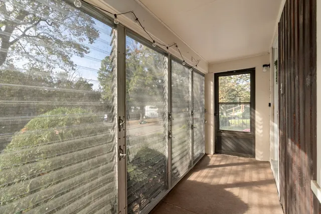 a bedroom with a bed and a television