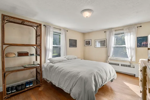 a room with a dresser and a window