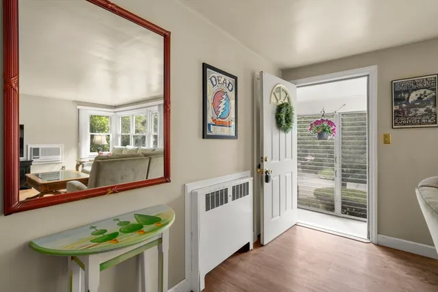 a view of an entryway with wooden floor