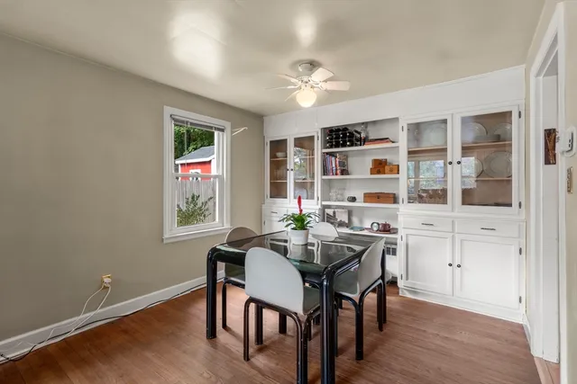 a view of a dining room with furniture and window