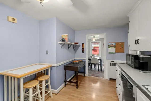 a kitchen with a sink and steel stainless steel appliances
