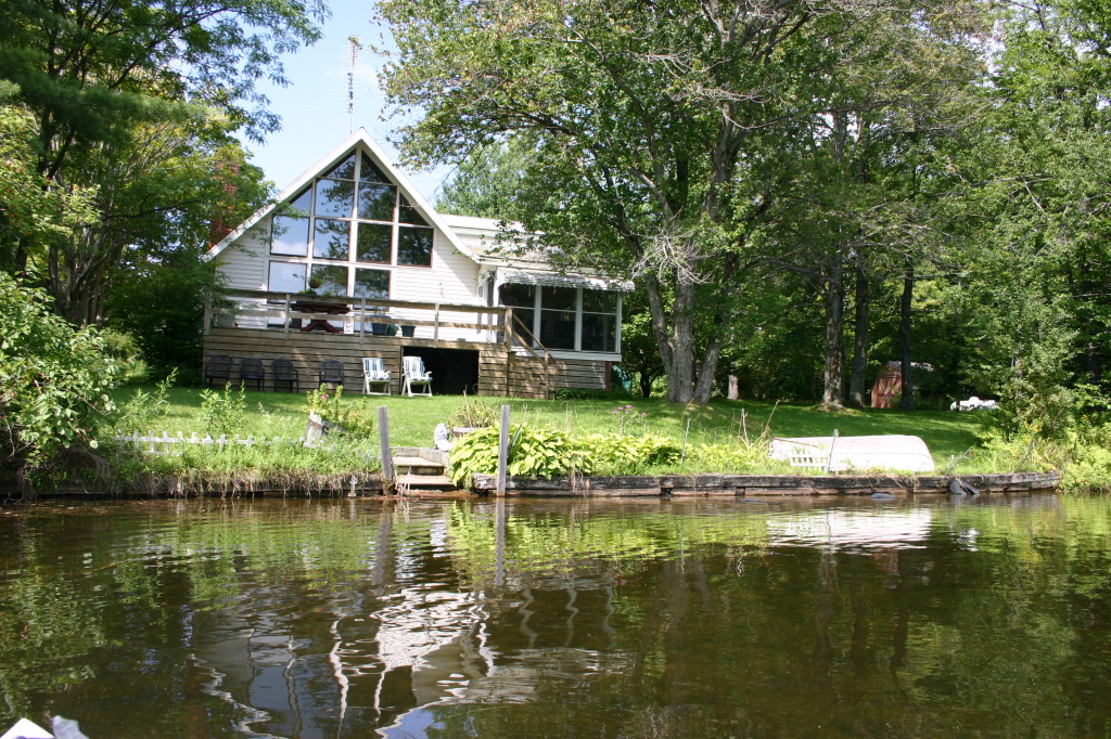 70 Tyringham Road Monterey, MA 01245 - Photo 1 of 22 a front view of a house with a yard