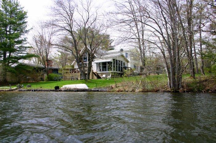 70 Tyringham Road Monterey, MA 01245 - Photo 20 of 22 a view of a house with a yard and plants