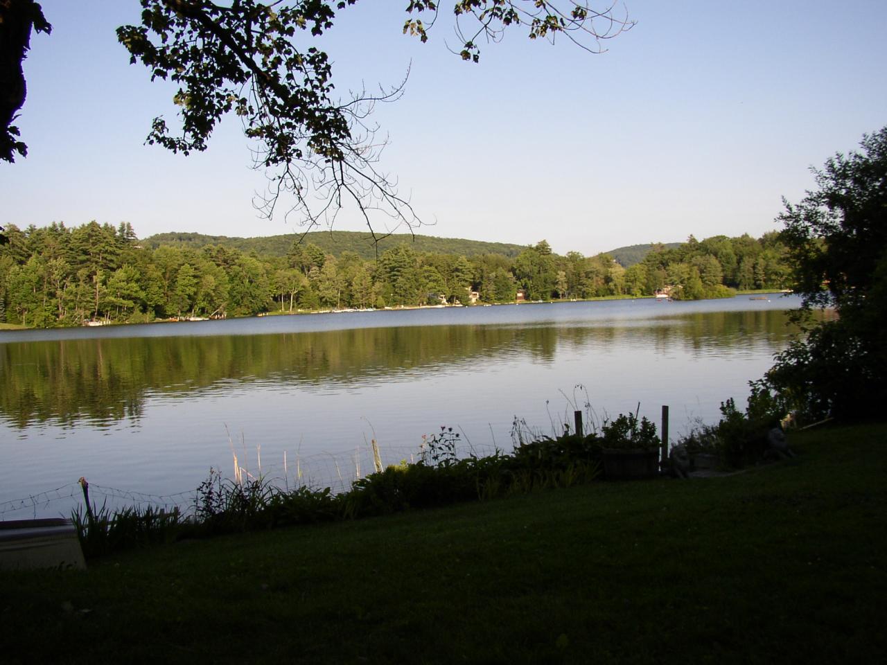 70 Tyringham Road Monterey, MA 01245 - Photo 21 of 22 a view of a lake with a mountain in the background