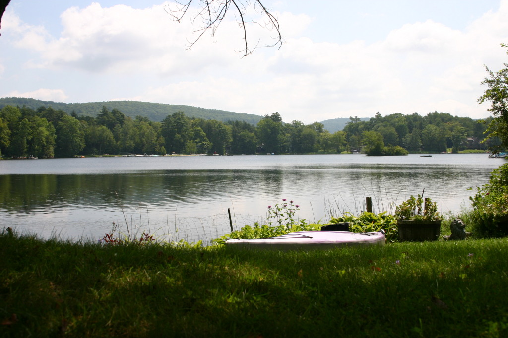 70 Tyringham Road Monterey, MA 01245 - Photo 22 of 22 a view of a lake with a big yard