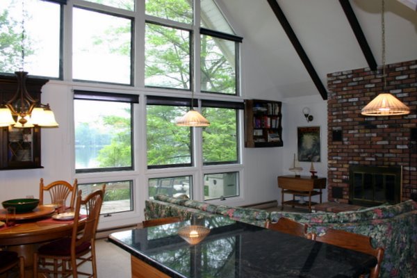 70 Tyringham Road Monterey, MA 01245 - Photo 7 of 22 a living room with furniture a window and a flat screen tv