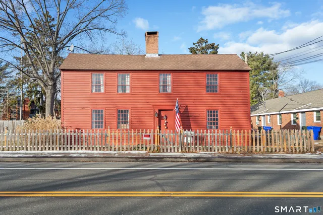 a view of a brick building next to a street