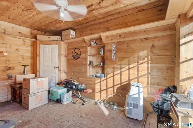 a view of storage and utility room with two windows