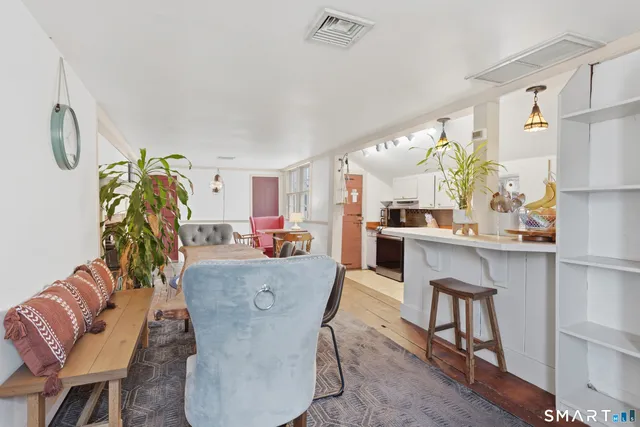 a kitchen with a stove a sink and a microwave