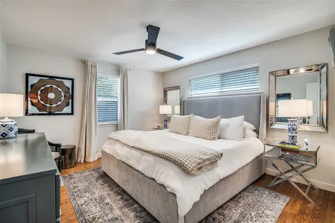 a spacious bedroom with a bed and a couch