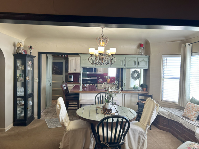 40 South State Street Scipio, UT 84656 - Photo 14 of 39 Carpeted dining room with a chandelier