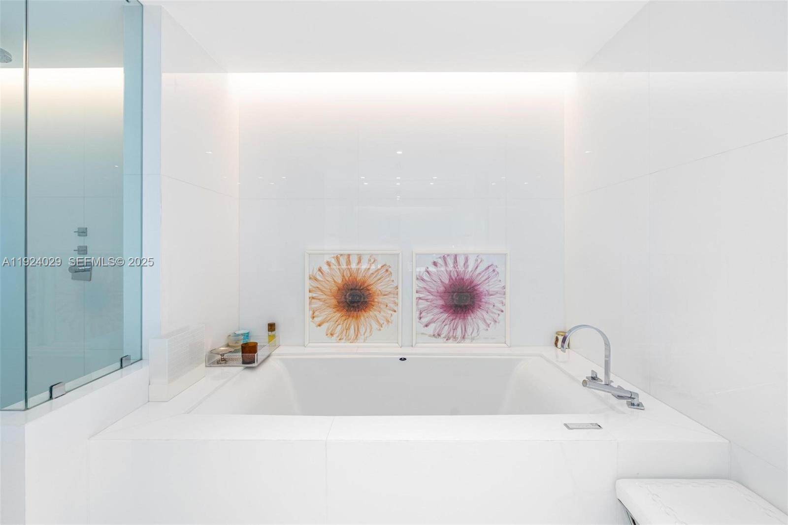 17121 Collins Avenue, Unit 3201 Sunny Isles Beach, FL 33160 - Photo 11 of 36 a bathroom with a bathtub