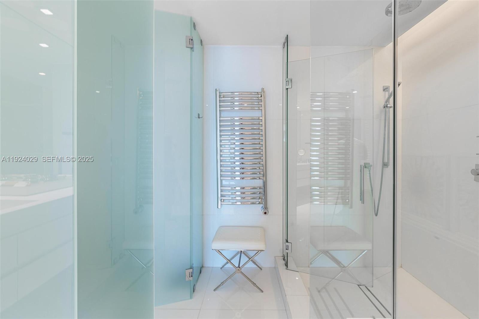 17121 Collins Avenue, Unit 3201 Sunny Isles Beach, FL 33160 - Photo 13 of 36 a bathroom with a shower