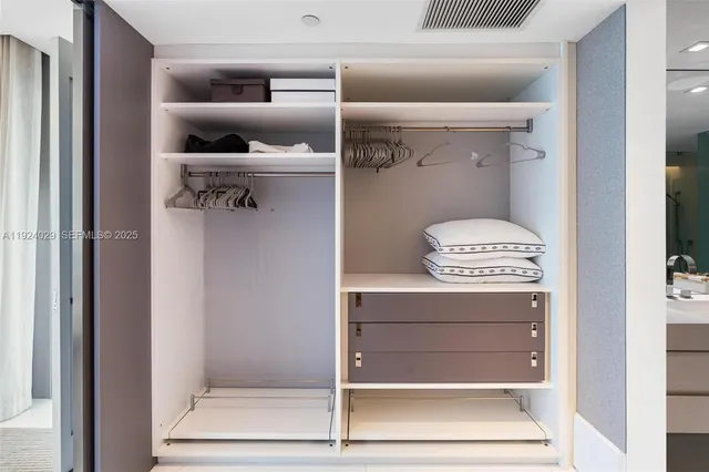 a kitchen with stainless steel appliances kitchen island granite countertop a stove a sink a refrigerator a microwave and cabinets