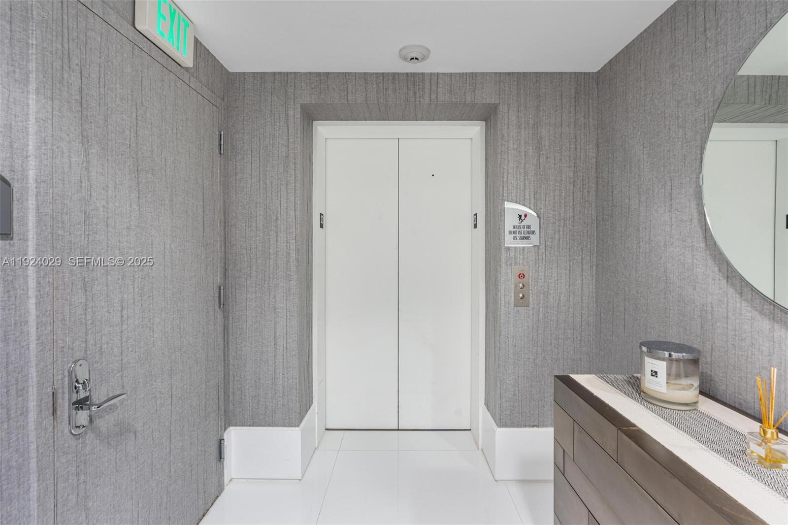 17121 Collins Avenue, Unit 3201 Sunny Isles Beach, FL 33160 - Photo 5 of 36 a bathroom with a granite countertop sink a toilet and shower