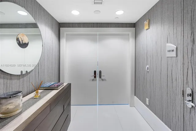 a bathroom with a mirror and a shower
