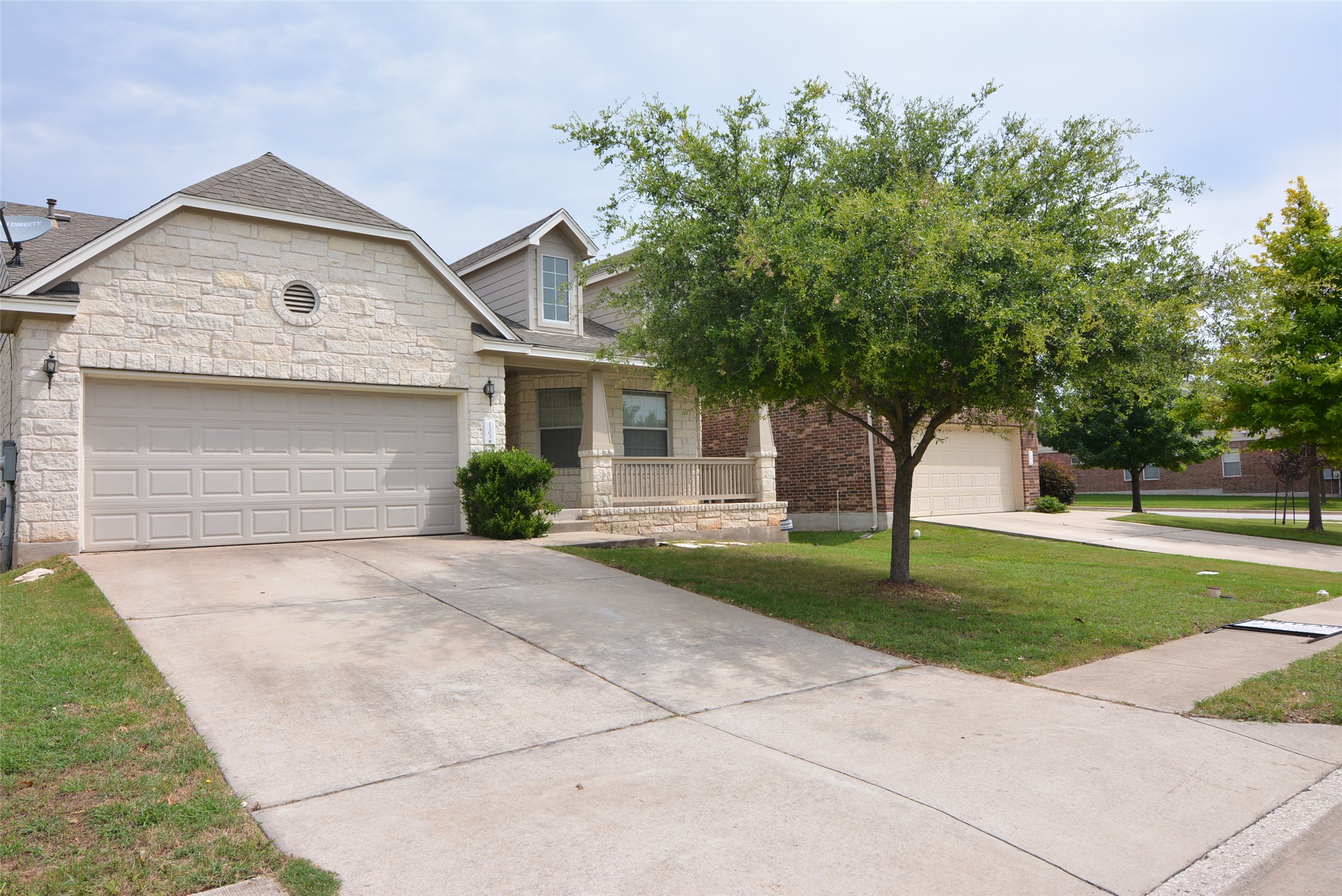 1303 Horseshoe Ranch Drive Leander, TX 78641 - Photo 2 of 26 A welcoming front porch invites you into this charming home with a practical attached garage.
