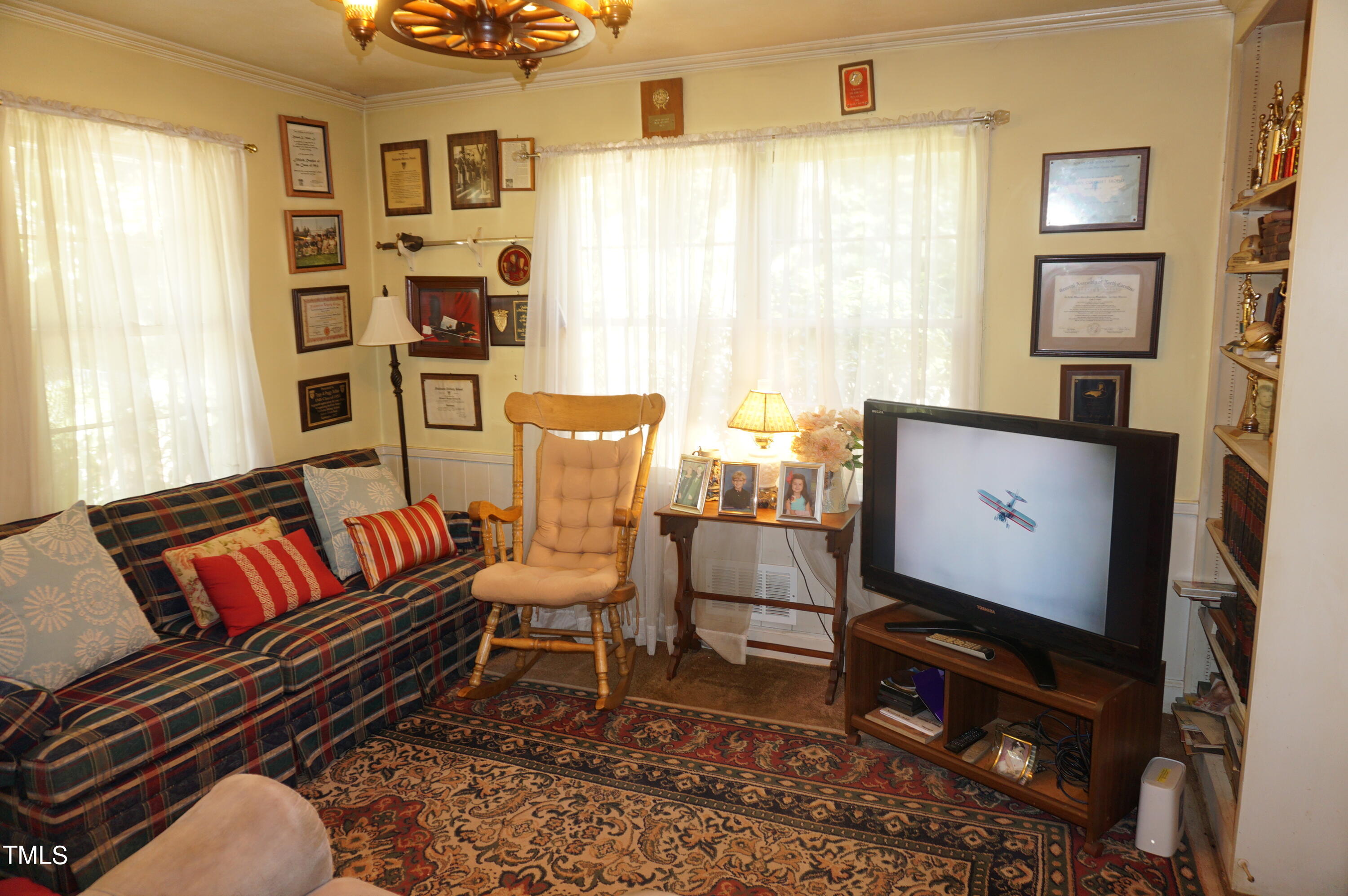 3406 Cherry Lane Raleigh, NC 27607 - Photo 24 of 31 a living room with furniture and a window