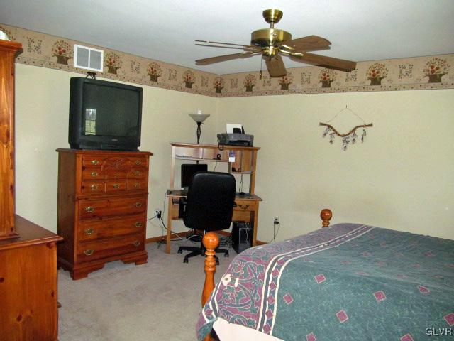 400 Heyer Mill Road Nazareth, PA 18064 - Photo 21 of 27 a bedroom with a bed and cabinets