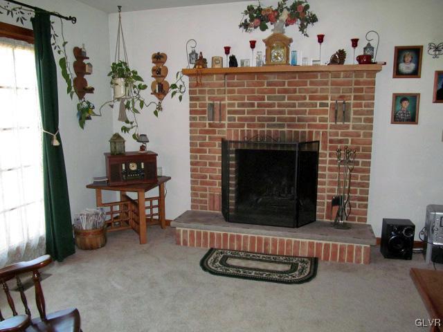 400 Heyer Mill Road Nazareth, PA 18064 - Photo 9 of 27 a living room with furniture and a fireplace