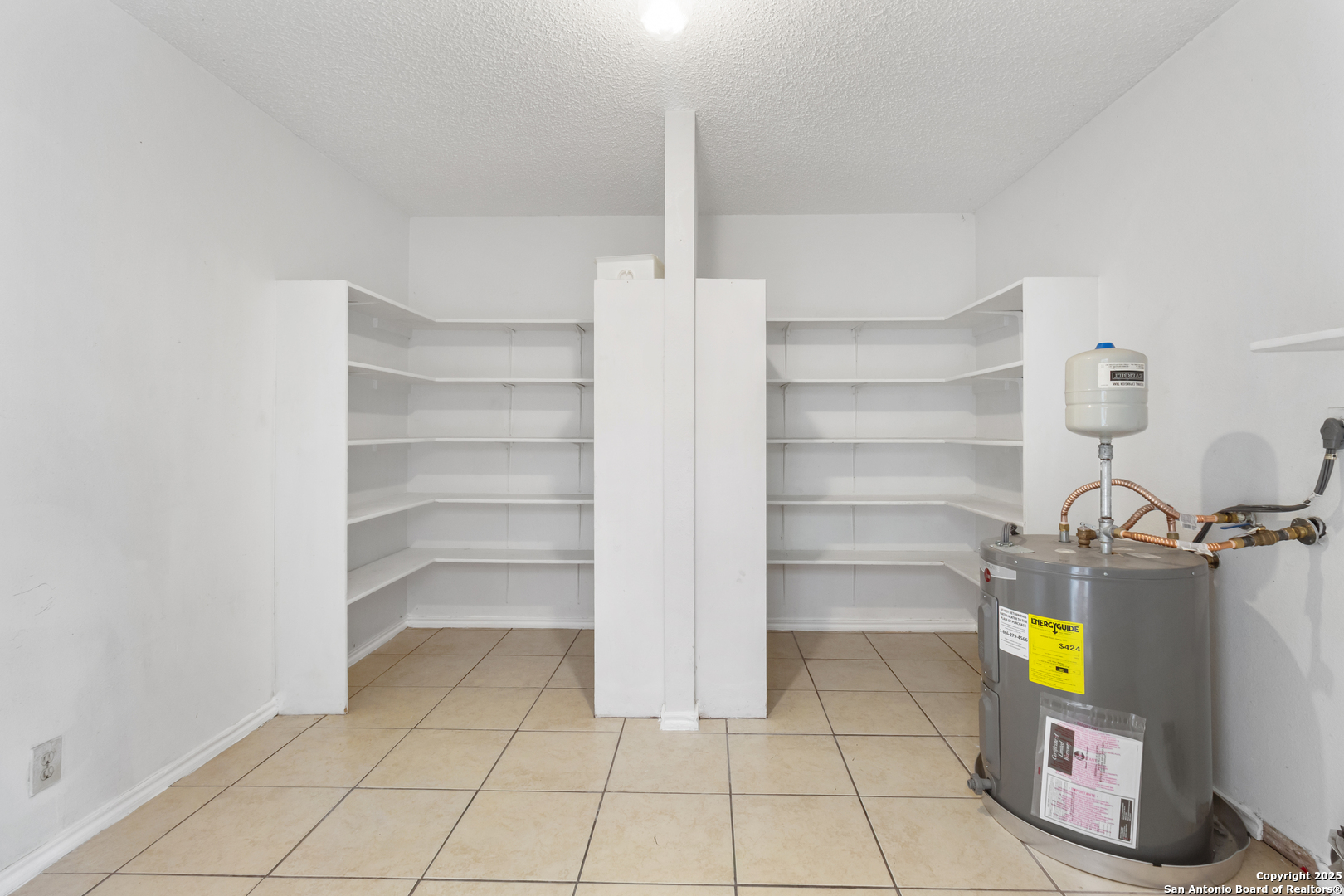 8310 Border Ridge Drive San Antonio, TX 78240 - Photo 11 of 24 a view of walk in closet with empty racks