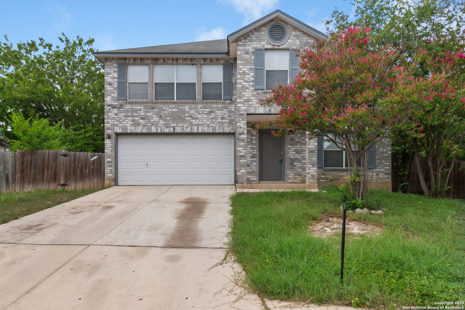 8310 Border Ridge Drive San Antonio, TX 78240 - Photo 2 of 24 a front view of a house with a yard and trees