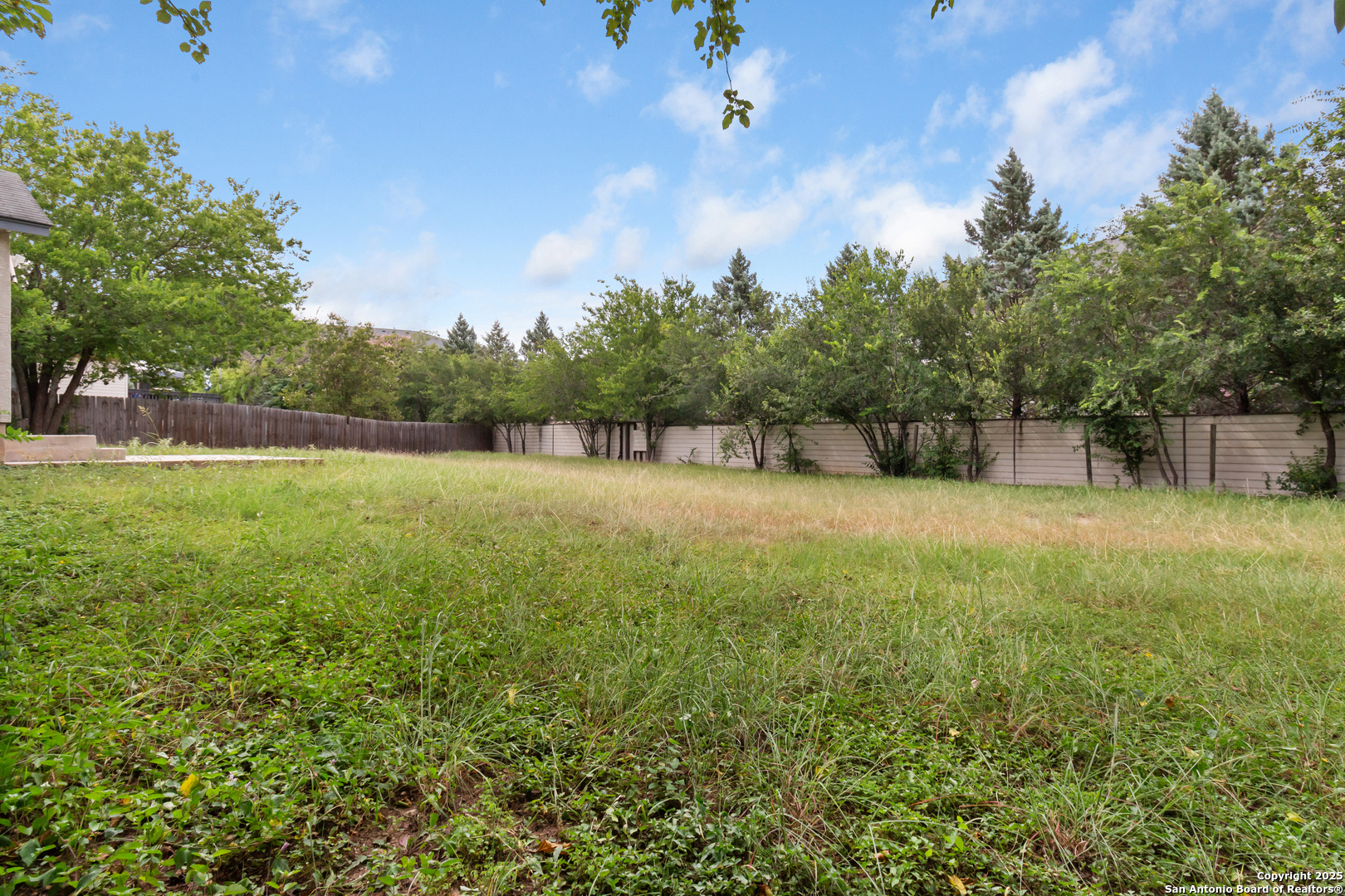 8310 Border Ridge Drive San Antonio, TX 78240 - Photo 22 of 24 a view of a outdoor space and a yard