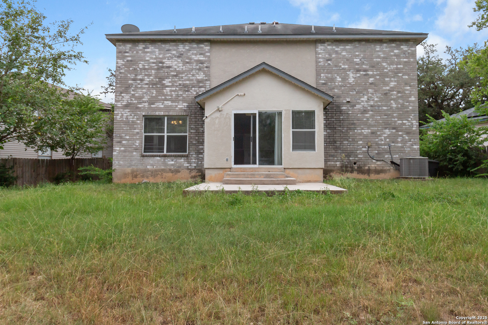 8310 Border Ridge Drive San Antonio, TX 78240 - Photo 24 of 24 a front view of a house with a yard