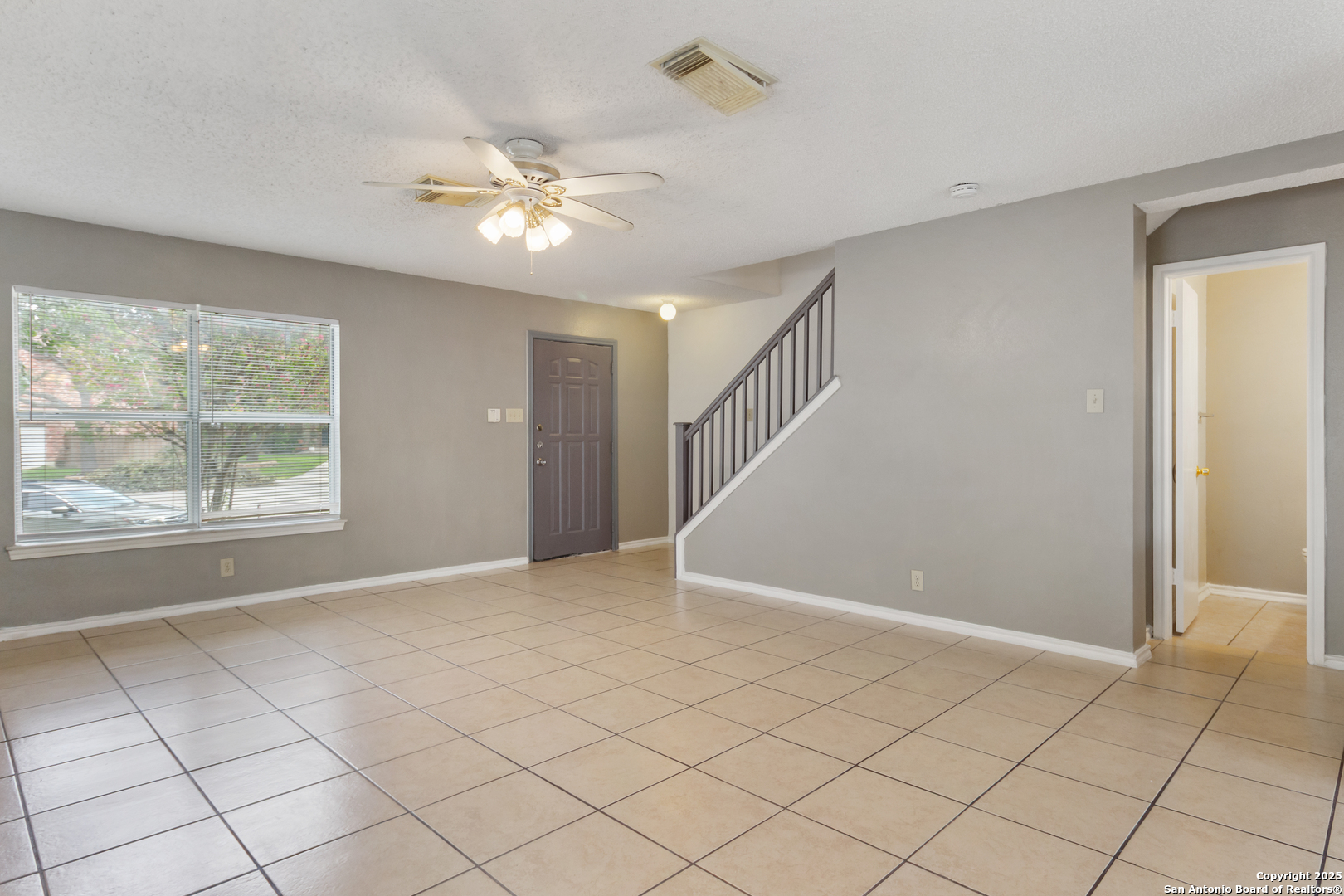 8310 Border Ridge Drive San Antonio, TX 78240 - Photo 4 of 24 a view of an empty room with a window