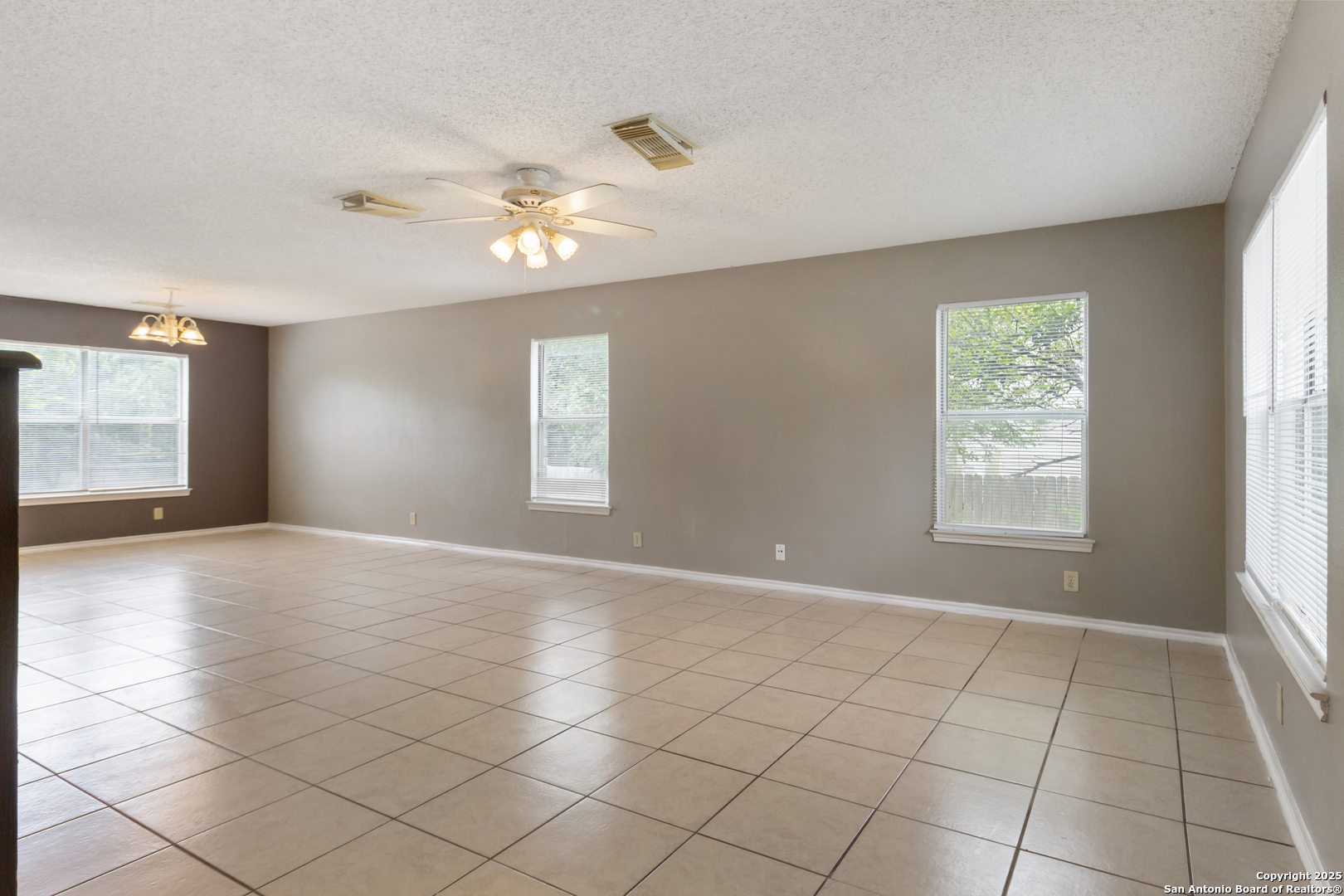 8310 Border Ridge Drive San Antonio, TX 78240 - Photo 5 of 24 a view of an empty room with a window
