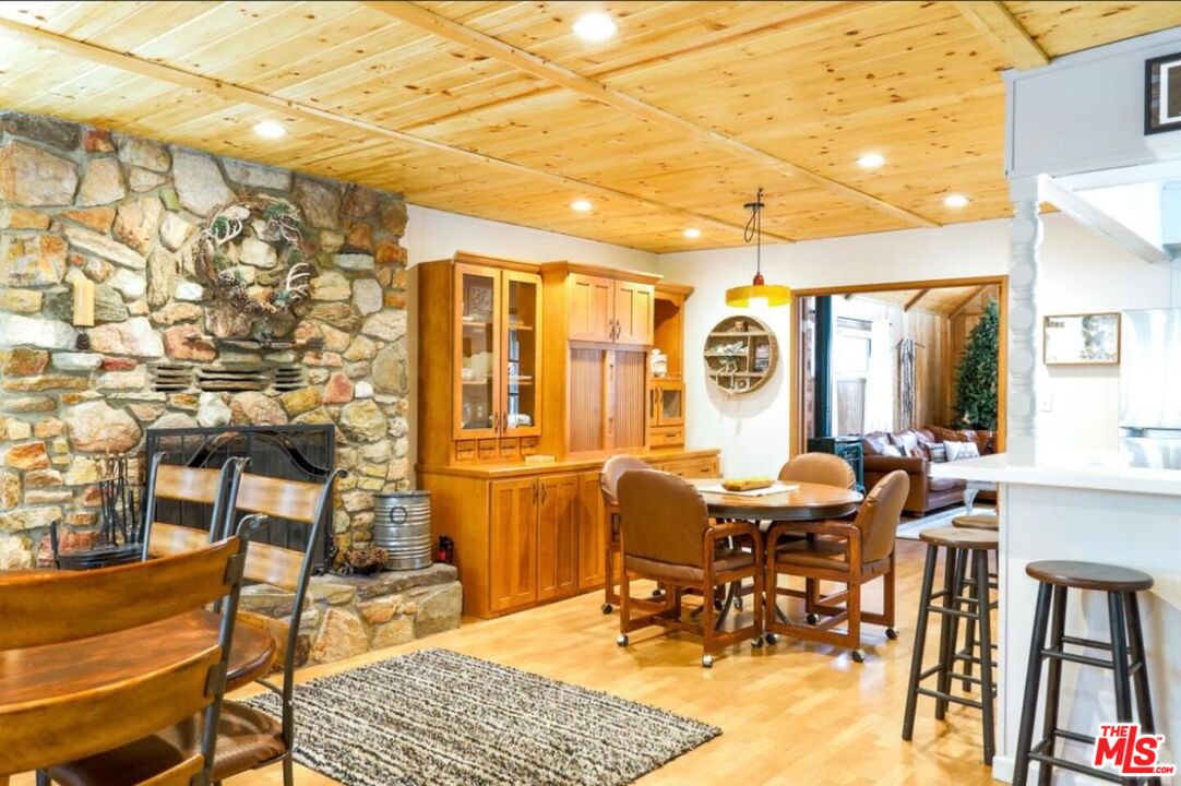 52521 Pine Ridge Road Idyllwild, CA 92549 - Photo 11 of 43 a dining room with chairs and window