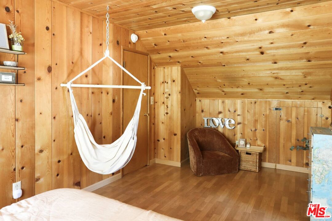 52521 Pine Ridge Road Idyllwild, CA 92549 - Photo 16 of 43 a room with furniture and a wooden floor