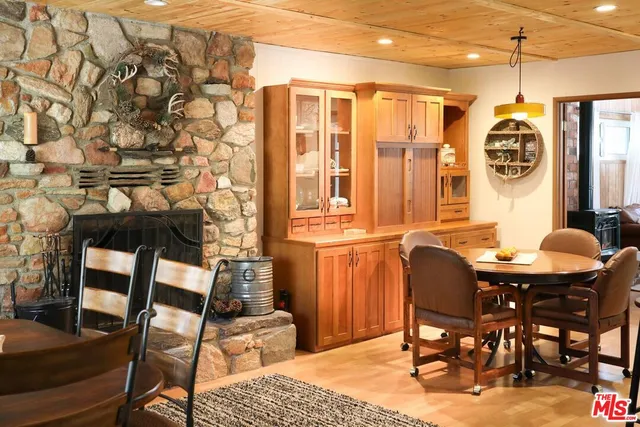 a view of a dining room with furniture and chandelier