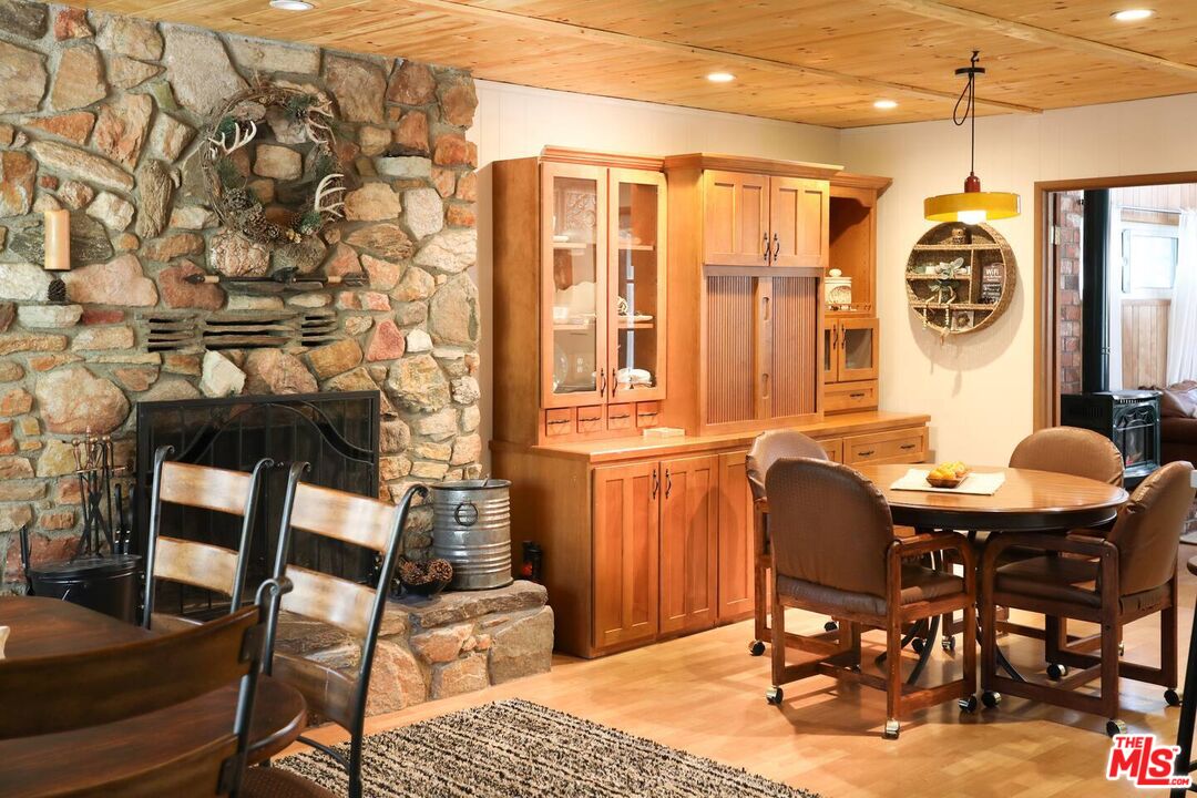 52521 Pine Ridge Road Idyllwild, CA 92549 - Photo 2 of 43 a view of a dining room with furniture and chandelier