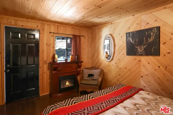 a view of a dining room with furniture and a large window