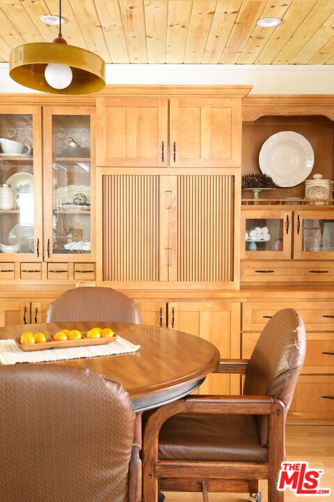 52521 Pine Ridge Road Idyllwild, CA 92549 - Photo 24 of 43 a view of a dining room with furniture and a large window