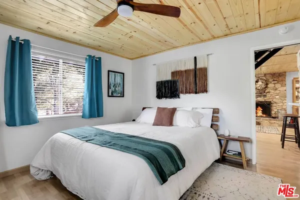 a view of a dining room with furniture and a large window