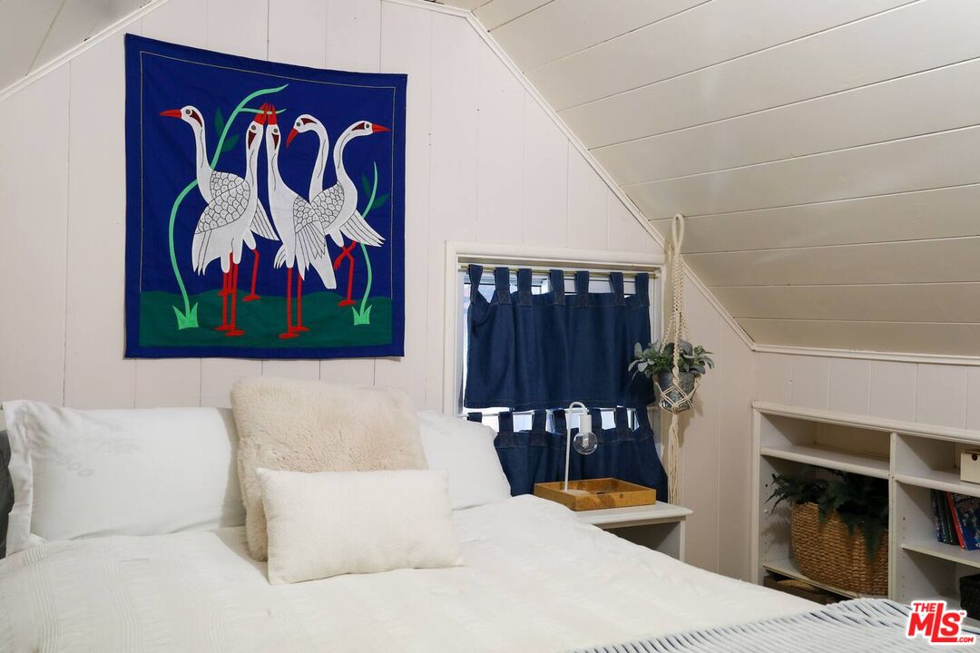 52521 Pine Ridge Road Idyllwild, CA 92549 - Photo 42 of 43 a bedroom with a bed and a painting on the wall