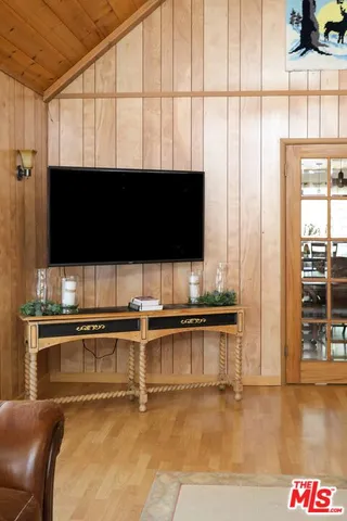 a view of living room with furniture and flat screen tv