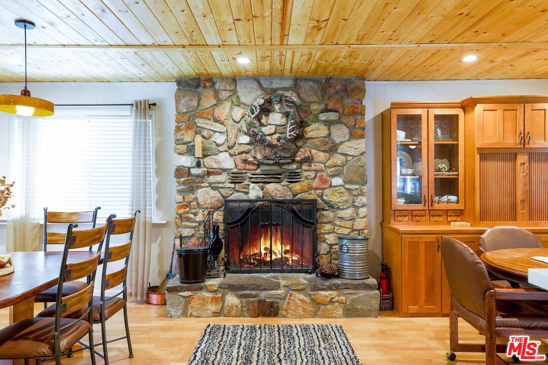 52521 Pine Ridge Road Idyllwild, CA 92549 - Photo 10 of 43 a living room with furniture and a fireplace