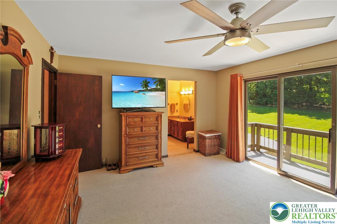 3470 Brodhead Road Bethlehem, PA 18020 - Photo 56 of 84 A comfortable bedroom with plush carpet and a refreshing view of nature from the private deck.