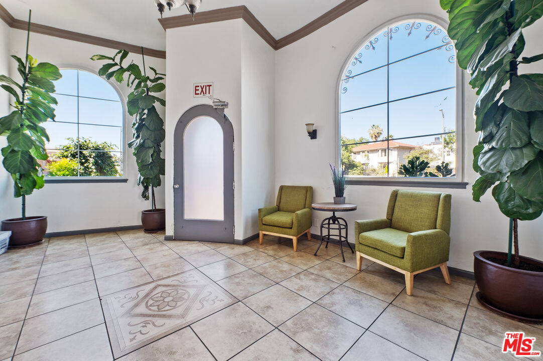 5320 West Olympic Boulevard, Unit 4 Los Angeles, CA 90036 - Photo 3 of 11 a living room with furniture and a window