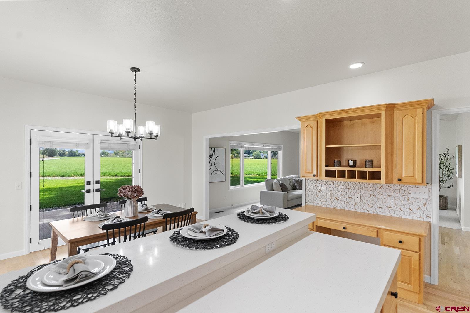 66356 Otter Road Montrose, CO 81403 - Photo 13 of 45 a room with furniture a window and a chandelier