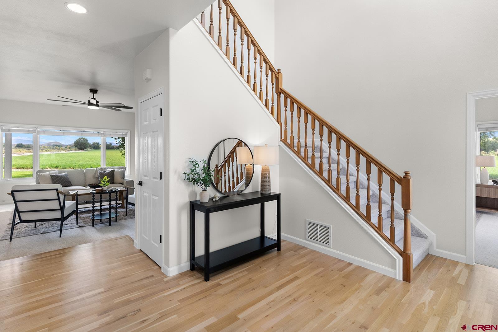 66356 Otter Road Montrose, CO 81403 - Photo 19 of 45 a view of staircase with furniture and a window