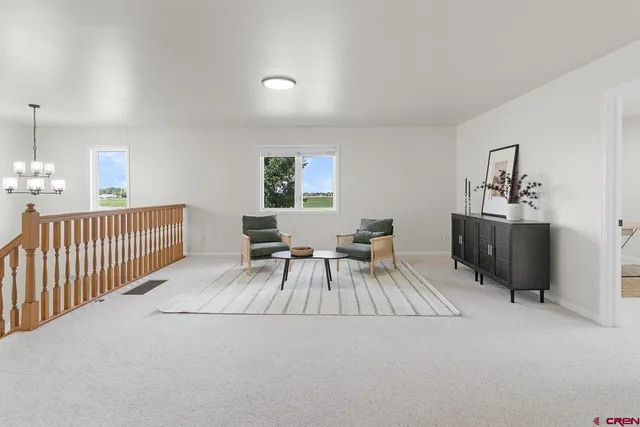 a spacious bedroom with a bed and a window