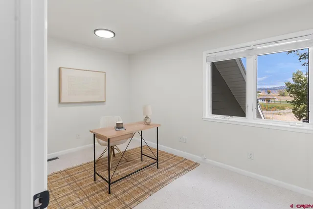 a bathroom with a granite countertop sink mirror and shower