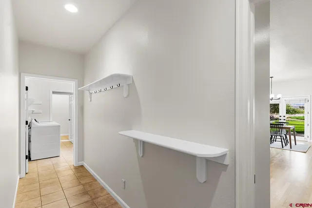 a view of a bathroom with a sink and washing machine